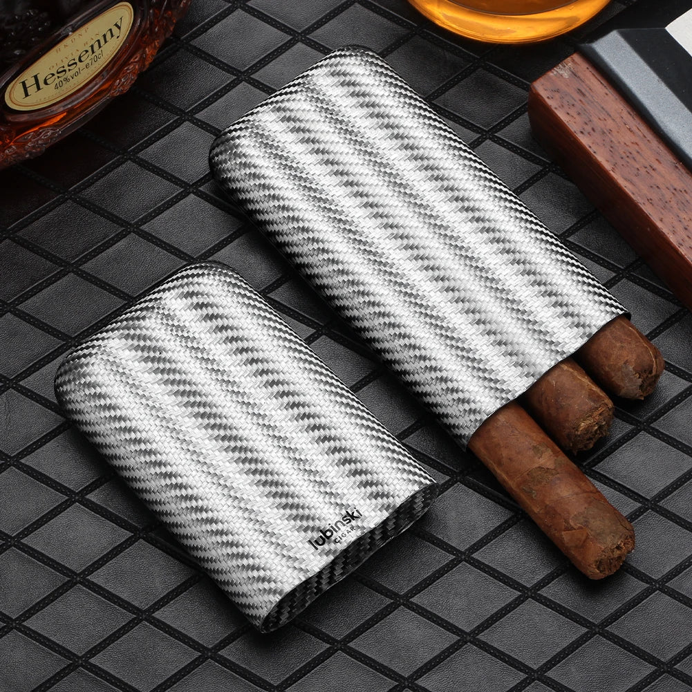 Two herringbone-patterned cigar cases with cigars on a checkered surface, with 'Hessny' brand visible.