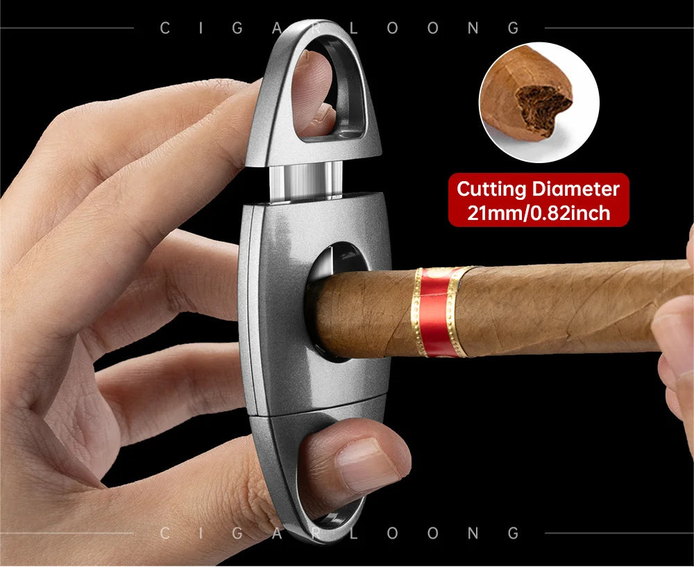 Cigar cutter with a hand holding a cigar, showing the cutting diameter, on a black background.