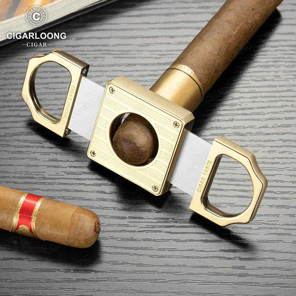 Gold cigar cutter with a cigar on a gray surface, featuring Cigarloong branding.