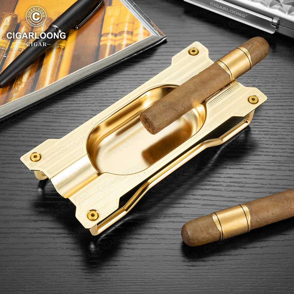 Gold cigar cutter with a cigar on a dark surface, with 'Cigarloong' branding.