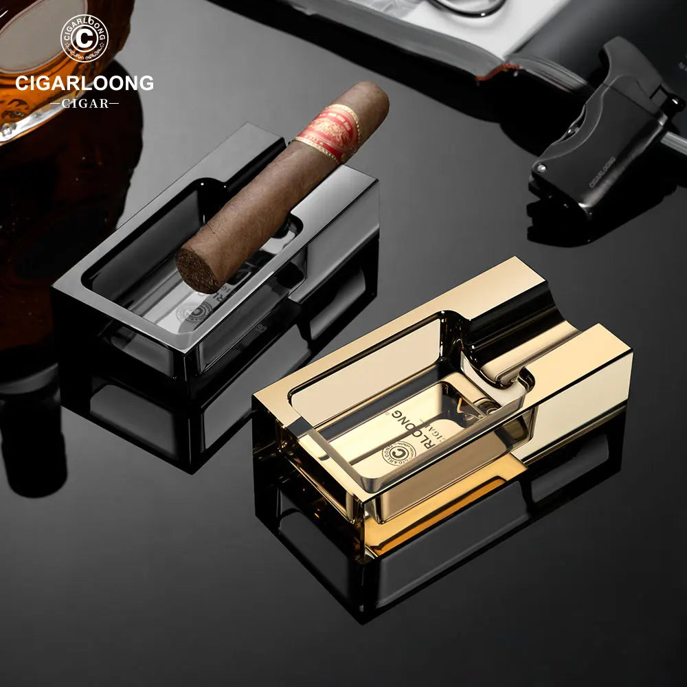 Cigar and gold lighter on a reflective surface with Cigarloong branding.