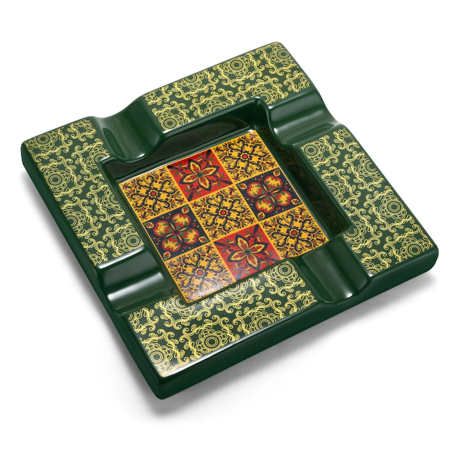 Decorative green ashtray with intricate patterns on a white background